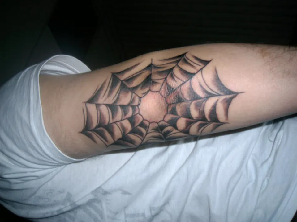 What Does a Spider Web Tattoo Mean? Find Out More!